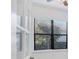 Bright room featuring a large window with views of mature landscaping and trees at 9914 Craftsman Park Way, Palmetto, FL 34221