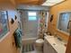 Bright bathroom featuring a shower-tub combination, linen closet, and colorful seahorse themed decor at 1007 Pussywillow Ln, Bradenton, FL 34208
