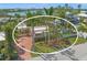 Aerial view of the property showcasing the home, pool, and waterfront location at 107 Nippino W Trl, Nokomis, FL 34275