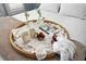 Up close view of a styled serving tray on a bed, complete with a magazine, drinks and berries at 107 Nippino W Trl, Nokomis, FL 34275