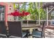 Outdoor dining area on screened porch with table and seating at 107 Nippino W Trl, Nokomis, FL 34275