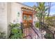 Close-up of the front entrance with detailed wooden door and decorative accents at 107 Nippino W Trl, Nokomis, FL 34275