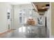 Bright kitchen featuring a cake under glass on granite countertops with natural light from shuttered windows at 107 Nippino W Trl, Nokomis, FL 34275