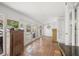 Bright living area with terracotta tile flooring and access to the pool at 107 Nippino W Trl, Nokomis, FL 34275
