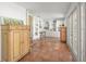 Open living area with terracotta tile flooring and ample natural light at 107 Nippino W Trl, Nokomis, FL 34275