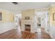 Cozy living room with fireplace and views of the pool at 107 Nippino W Trl, Nokomis, FL 34275