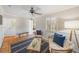 Inviting living room with charming tile floors, wainscoting, and cozy seating at 107 Nippino W Trl, Nokomis, FL 34275