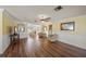 Spacious living room featuring wood floors, ample natural light, and decorative accents at 107 Nippino W Trl, Nokomis, FL 34275