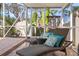 Relaxing screened-in patio area with lounge chairs at 107 Nippino W Trl, Nokomis, FL 34275