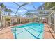 Large screened-in pool with ample space for lounging and recreation at 107 Nippino W Trl, Nokomis, FL 34275