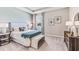 This bedroom has carpet, a cushioned bench, and a headboard with a decorative pattern at 10713 Tippecanoe Pl, Parrish, FL 34219