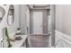 Light-filled entryway with decorative mirrors, table decor, gray walls and white trim at 10713 Tippecanoe Pl, Parrish, FL 34219