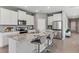 Modern kitchen featuring granite countertops, stainless steel appliances and a breakfast bar at 10713 Tippecanoe Pl, Parrish, FL 34219