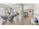 Bright, open-concept living room, with multiple windows, neutral decor and tile floors at 10713 Tippecanoe Pl, Parrish, FL 34219