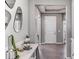 Elegant home entryway featuring neutral colors, tile flooring, and a decorative console table with accessories at 10717 Tippecanoe Pl, Parrish, FL 34219