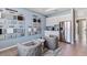 This showroom features a cabinet display, chair seating, and a stainless steel fridge at 10717 Tippecanoe Pl, Parrish, FL 34219