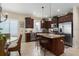 Well-equipped kitchen featuring a central island with bar seating and ample counter space at 11021 Blue Magnolia Ln, Parrish, FL 34219