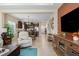 Bright and inviting living room showcasing an entertainment center and cozy seating area at 11021 Blue Magnolia Ln, Parrish, FL 34219