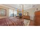 Four-poster bedroom with a view and a window seat at 11176 Roseate Ct, Sarasota, FL 34238