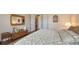 Spacious bedroom with a mirror, dresser, and patterned comforter at 11176 Roseate Ct, Sarasota, FL 34238