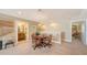 Bonus room showcasing a round table and access to bathroom and additional spaces at 11176 Roseate Ct, Sarasota, FL 34238