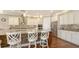 Bright kitchen featuring a large granite island with bar seating, stainless steel appliances, and tiled backsplash at 11176 Roseate Ct, Sarasota, FL 34238