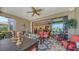 Spacious lanai featuring comfortable seating, dining area, and serene views, seamlessly blending indoor and outdoor living at 11176 Roseate Ct, Sarasota, FL 34238