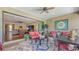 Relax in this covered lanai with cozy seating, overlooking the lush yard and offering indoor-outdoor living at 11176 Roseate Ct, Sarasota, FL 34238