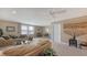 Spacious living room with a comfortable couch, glass coffee table, and cozy decor at 11176 Roseate Ct, Sarasota, FL 34238