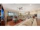 Open-concept living area showcasing a modern kitchen, dining area and sliding glass doors to a lanai at 11176 Roseate Ct, Sarasota, FL 34238