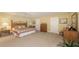 Large bedroom with a comfortable bed, dresser, and plenty of natural light at 11176 Roseate Ct, Sarasota, FL 34238