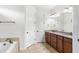 Bathroom boasts double sink vanity and garden tub at 11214 Sandhill Preserve Dr, Sarasota, FL 34238