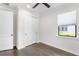 Bright bedroom with a ceiling fan, closet, and a window with privacy blinds at 11214 Sandhill Preserve Dr, Sarasota, FL 34238