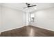 This is a bedroom with dark wooden floors and a ceiling fan at 11214 Sandhill Preserve Dr, Sarasota, FL 34238
