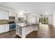 Open-concept kitchen features an island, stainless steel appliances, and ample counter space at 11214 Sandhill Preserve Dr, Sarasota, FL 34238
