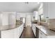 Contemporary kitchen boasts a large island, stainless steel appliances, and abundant counter space at 11214 Sandhill Preserve Dr, Sarasota, FL 34238