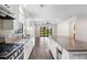 Bright kitchen features granite counters, stainless appliances, and hardwood floors at 11214 Sandhill Preserve Dr, Sarasota, FL 34238