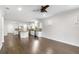 Open floor plan features hardwood floors connecting living room to kitchen at 11214 Sandhill Preserve Dr, Sarasota, FL 34238
