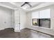 Bright office features a ceiling fan, hardwood floors, and a window offering lots of natural light at 11214 Sandhill Preserve Dr, Sarasota, FL 34238