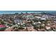 Stunning aerial view showcasing the neighborhood with the beach and ocean waters in the background on a sunny day at 113 Fillmore Dr, Sarasota, FL 34236