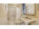 A traditional bathroom with subway tile and a shower-tub combo provides simple elegance at 113 Fillmore Dr, Sarasota, FL 34236