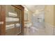 Well-lit bathroom features a glass enclosed shower and classic vanity with storage at 113 Fillmore Dr, Sarasota, FL 34236