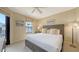 Cozy bedroom featuring a comfortable bed, neutral walls, and natural lighting at 113 Fillmore Dr, Sarasota, FL 34236