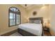 Bedroom featuring hardwood floors, neutral-colored walls, and natural lighting from a large window at 113 Fillmore Dr, Sarasota, FL 34236