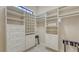 Custom closet featuring built-in shelving, drawers, and rods providing ample storage space at 113 Fillmore Dr, Sarasota, FL 34236