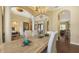 Elegant dining room with wooden floors, light yellow walls, decorative table decor, and open access to other rooms at 113 Fillmore Dr, Sarasota, FL 34236