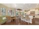 Spacious open-concept kitchen with a breakfast nook, granite countertops, hardwood floors, and stainless-steel appliances at 113 Fillmore Dr, Sarasota, FL 34236