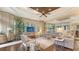 Bright and airy living room with large windows, neutral decor, and wood flooring at 113 Fillmore Dr, Sarasota, FL 34236