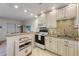 Well-lit kitchen area with modern appliances, cabinetry and counter space at 117 7Th N St # 35, Bradenton Beach, FL 34217