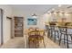 Open concept kitchen with breakfast bar, white cabinets and stainless appliances at 117 7Th N St # 35, Bradenton Beach, FL 34217